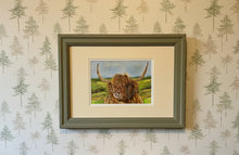 Load image into Gallery viewer, highland cow by a loch colouered pencil drawing by Helen Elizabeth Studios