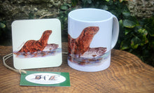 Load image into Gallery viewer, Wildlife Getting Along Collection - Otter and Salmon Ceramic Mug and Coaster by Helen Elizabeth
