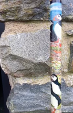 Load image into Gallery viewer, Puffins on rocks hand painted thumbstick by Helen Elizabeth