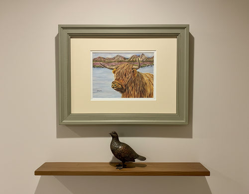 highland cow by a loch colouered pencil drawing by Helen Elizabeth Studios