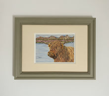 Load image into Gallery viewer, highland cow by a loch colouered pencil drawing by Helen Elizabeth Studios
